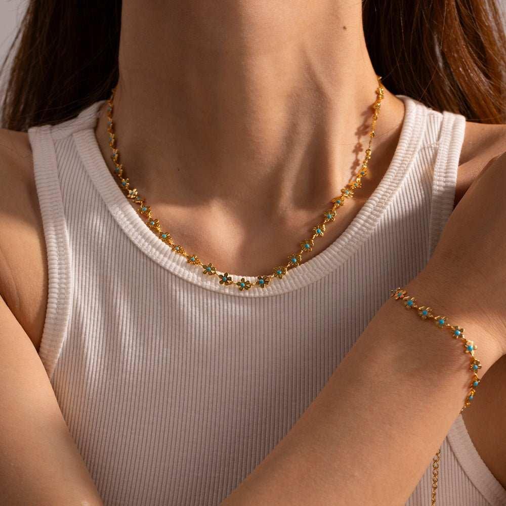 Add a touch of elegance to your outfit with our Glaze Flowers Necklace and Bracelet set. Made with delicate, handcrafted flowers, this set is perfect for any formal