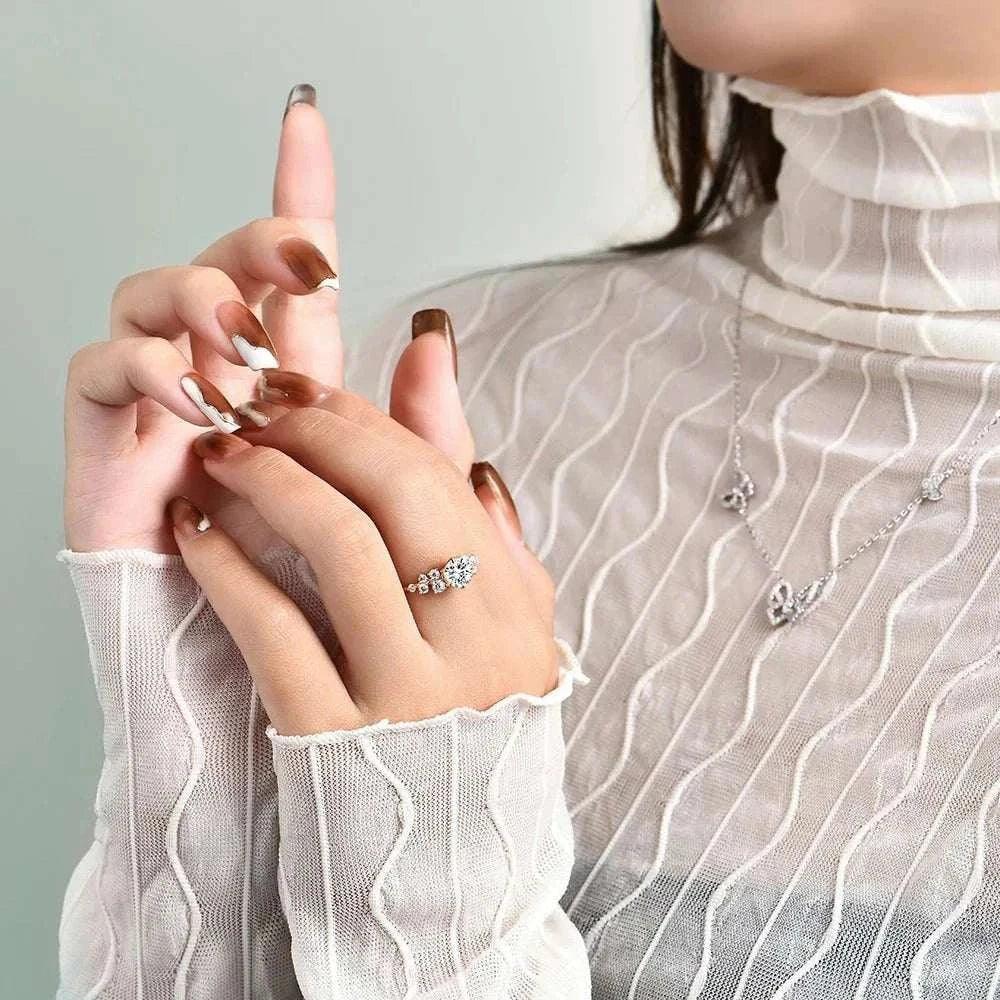 Artisan Moissanite Gold Ring on woman's hand, elegant and sustainable jewelry.