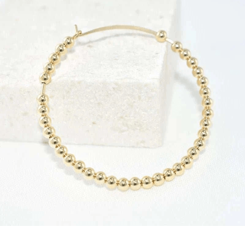 14K gold-filled everyday hoop earring, hypoallergenic and tarnish-resistant design.