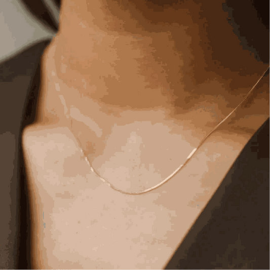 14K gold filled liquid chain necklace on neck, elegant and sophisticated design.