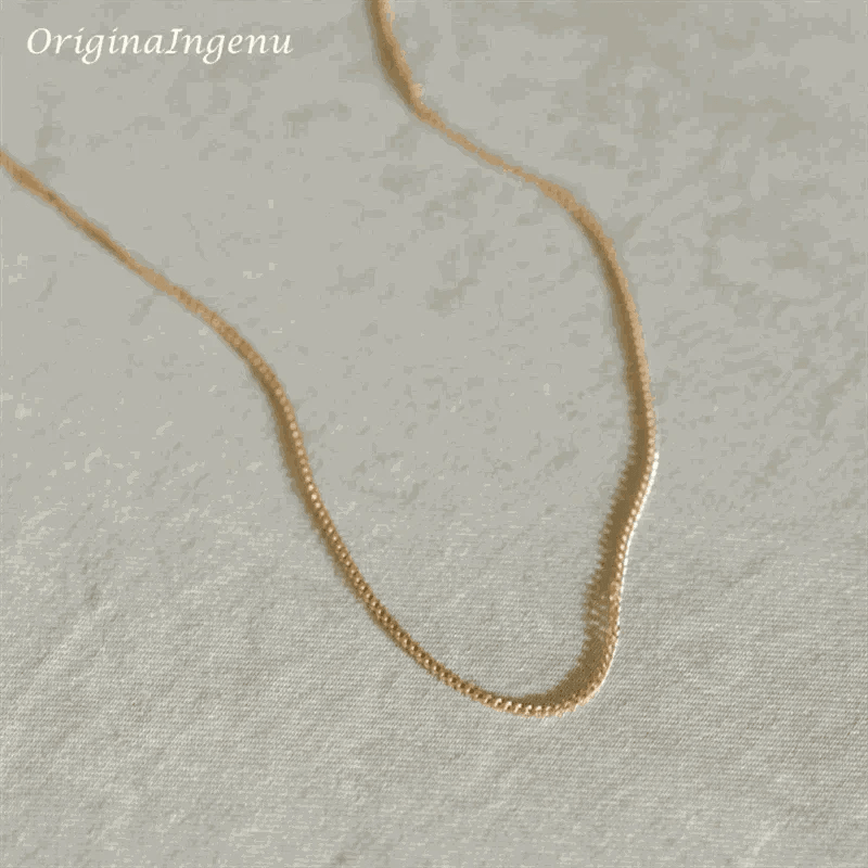 14K gold filled liquid chain necklace on light background