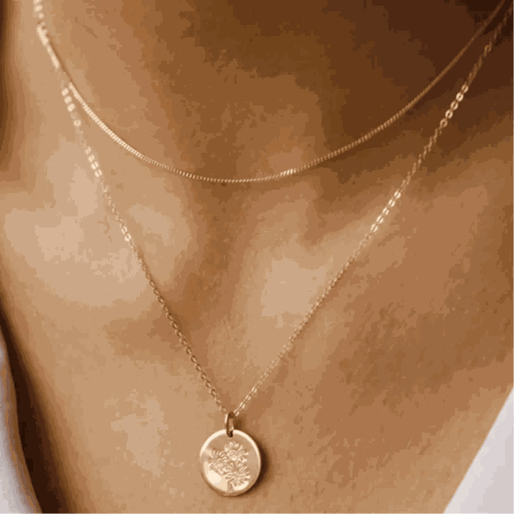 14k gold filled liquid chain necklace on woman's neck.