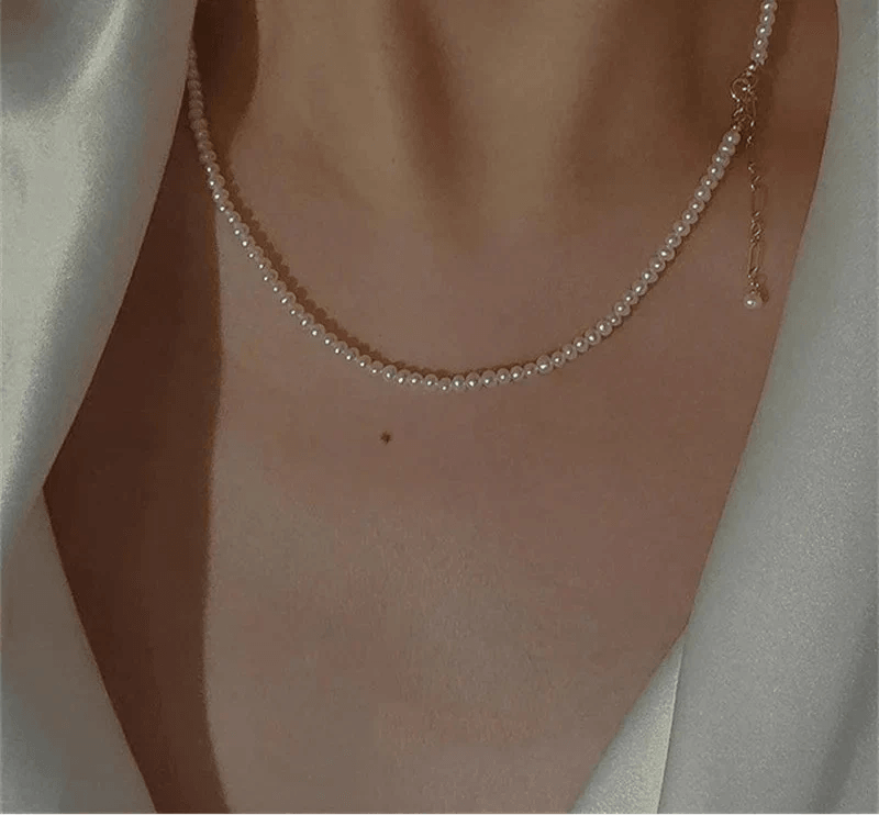 14K Gold Pearl Choker Necklace with elegant pearls and gold accents for versatile styling.