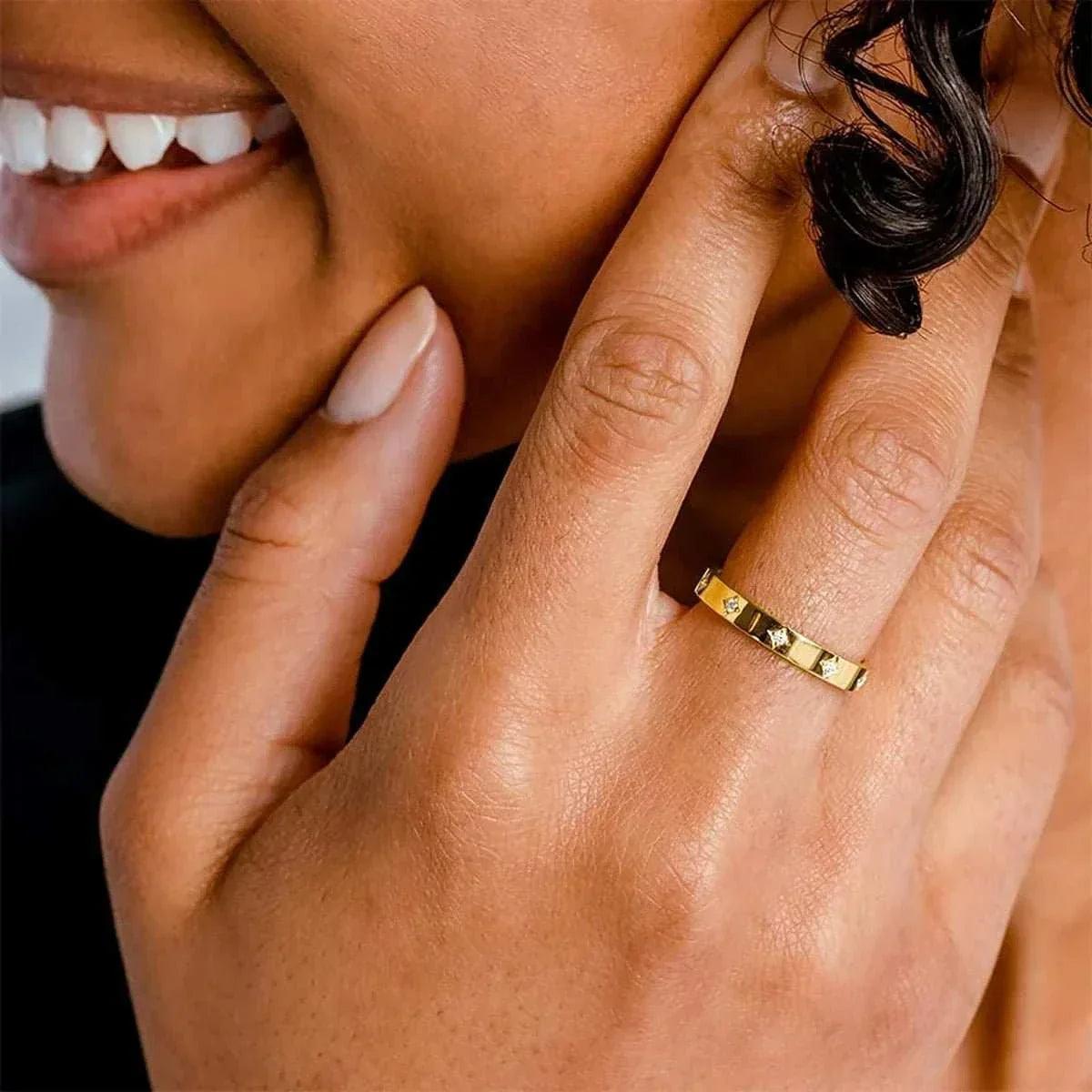 14k gold moissanite luxury wedding band for women on hand.