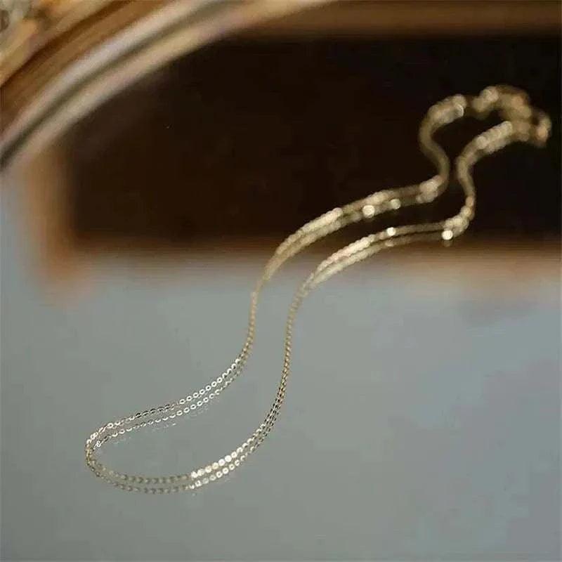 14K solid gold minimalist necklace reflecting elegance and sophistication.