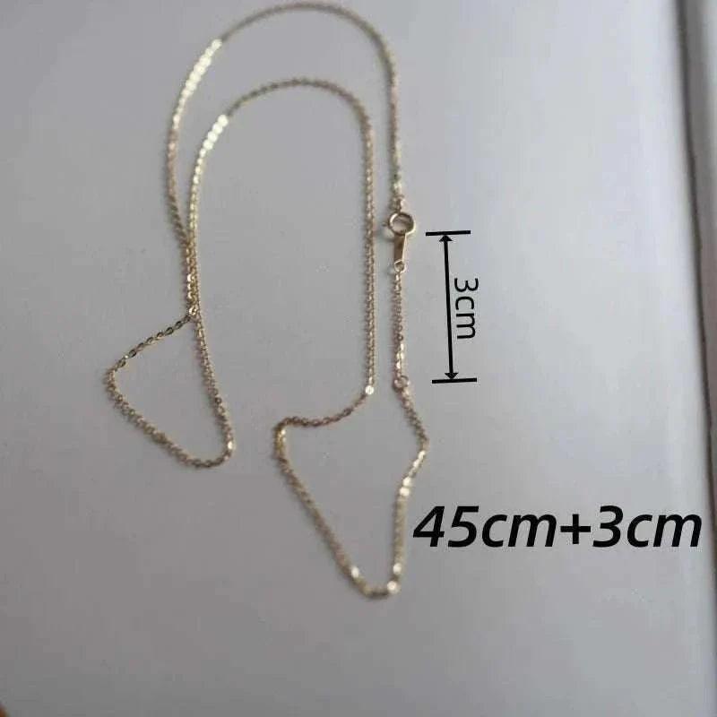 14K solid gold minimalist necklace measuring 45cm with a 3cm extension.