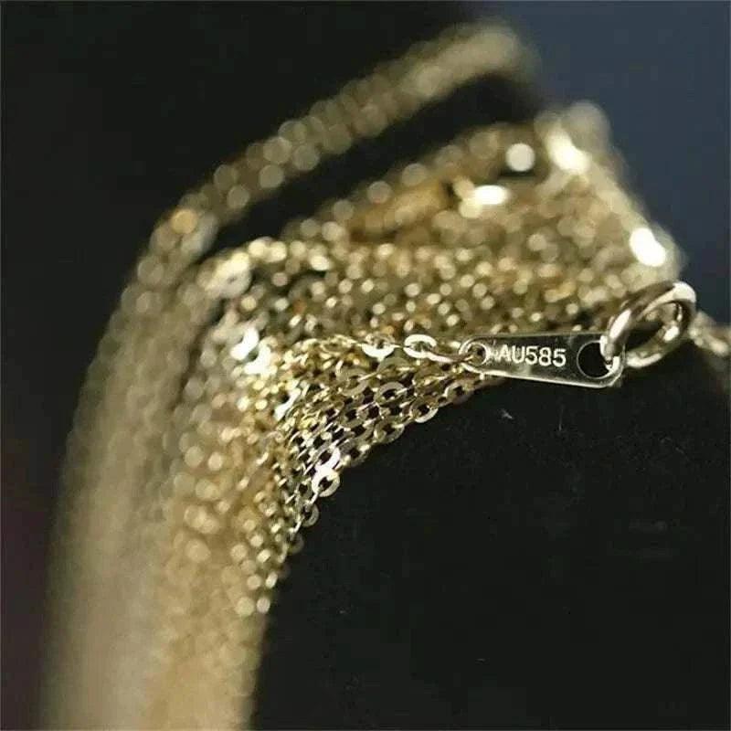14K solid gold minimalist necklace with delicate design and AU585 hallmark.