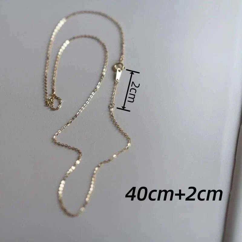 14K solid gold minimalist necklace on display, measuring 40cm+2cm.