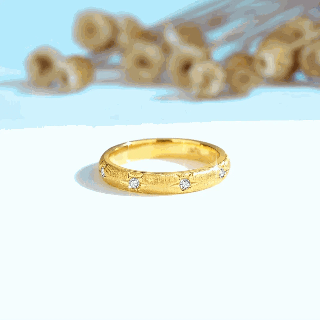 18K gold moissanite luxury diamond ring with round cut stones on a polished band.