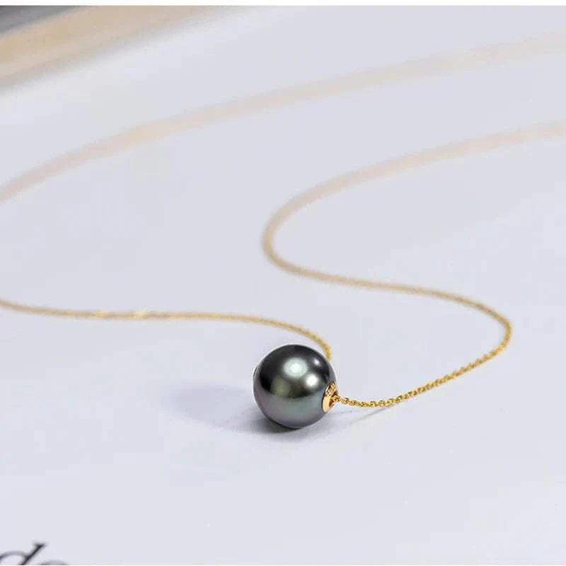 18K Gold Tahitian Black Pearl Pendant Necklace on a delicate gold chain.