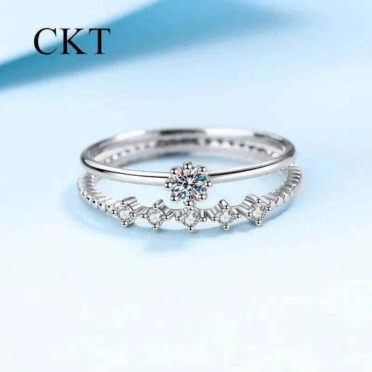 White gold moissanite ring with brilliant stones on a premium setting, perfect for engagements or anniversaries.