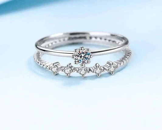 Elegant 18K white gold engagement ring with 0.5 carat moissanite centerpiece.