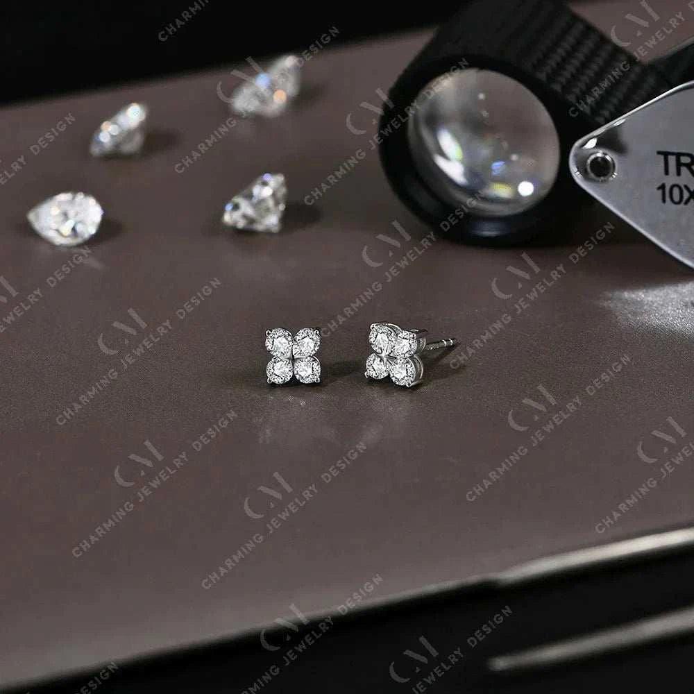 Dazzling moissanite flower earrings in silver and gold showcasing VVS1 D color diamonds.