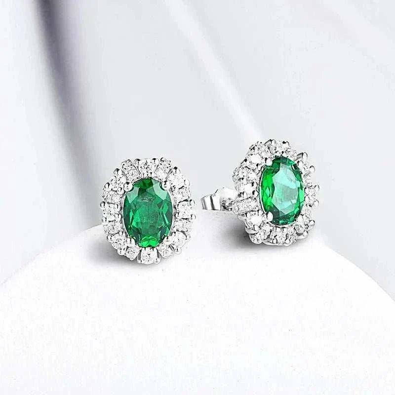 Elegant 925 silver emerald stud earrings with lab-created emerald stones and rhodium plating.