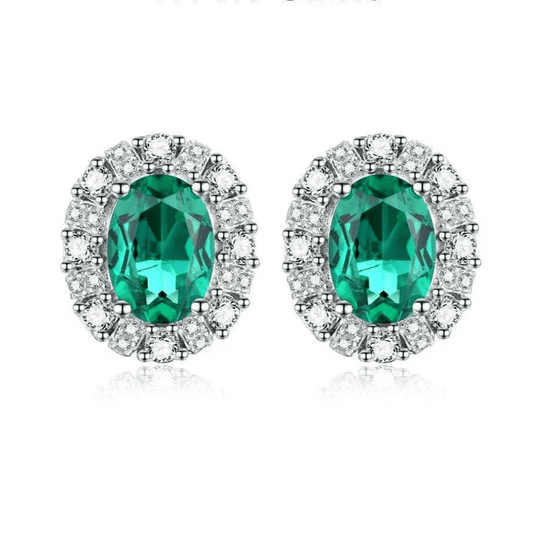Elegant 925 silver emerald stud earrings with dazzling oval-cut stones and rhodium plating.