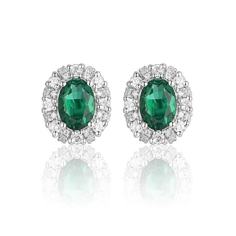 Elegant 925 silver emerald stud earrings with oval-cut green stones.