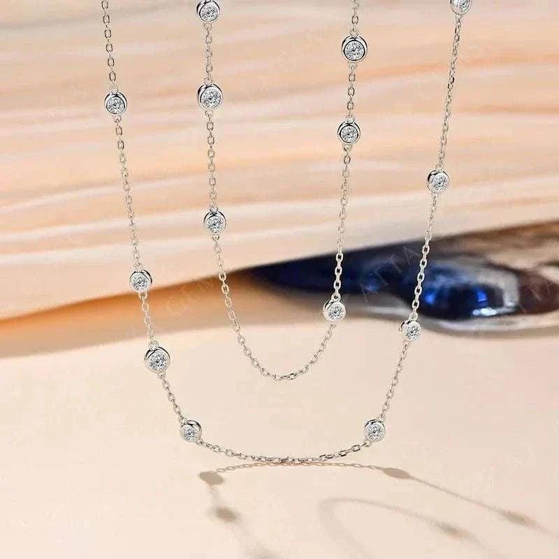 Elegant 925 silver moissanite necklace featuring round cut stones on a delicate chain.
