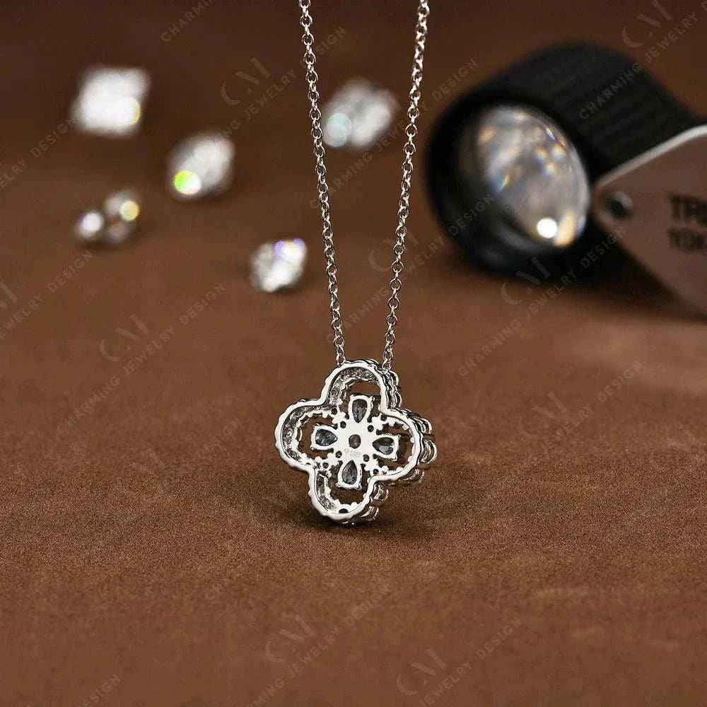 Elegant Moissanite flower necklace in sterling silver on a brown background.