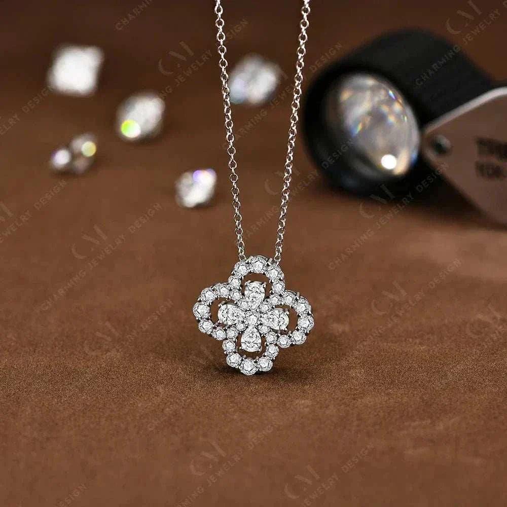 Elegant moissanite flower necklace in sterling silver with a sparkling pendant.