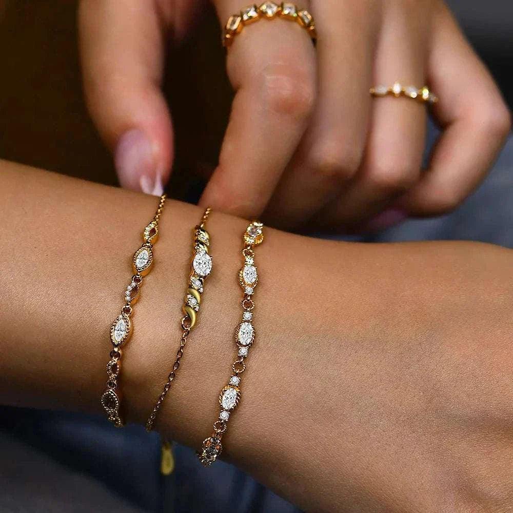 Elegant moissanite oval cut bracelet with 10k gold plating, showcasing dazzling gems on a woman's wrist.