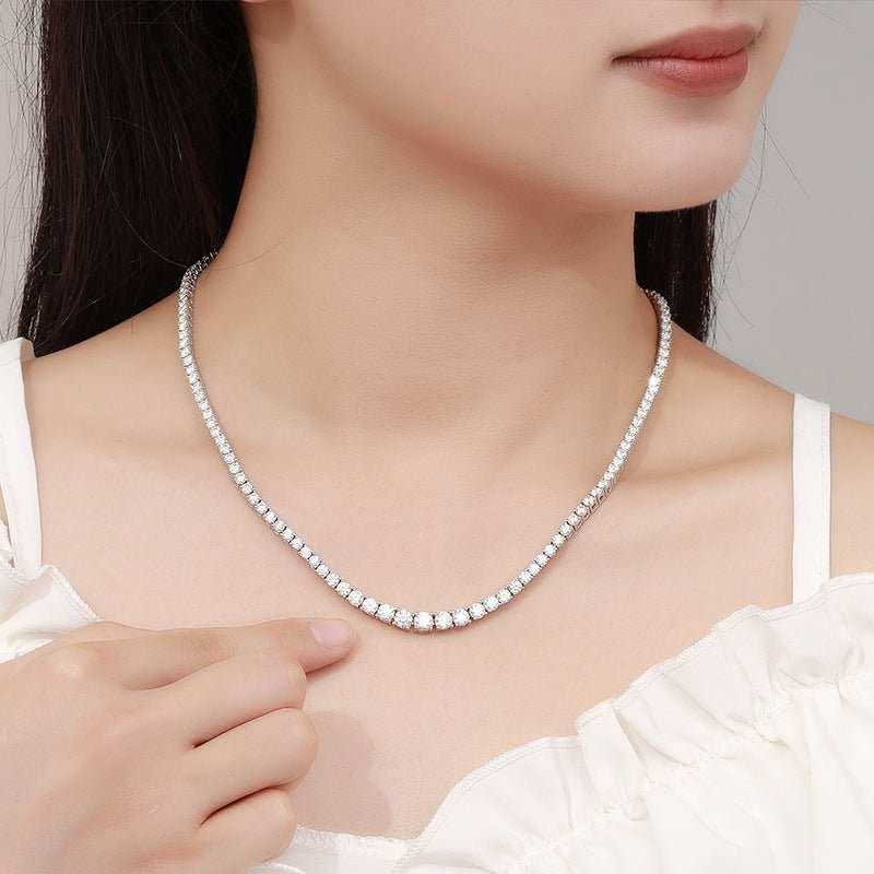 Elegant moissanite silver necklace on a woman's neck showcasing dazzling sparkle and sophisticated design.