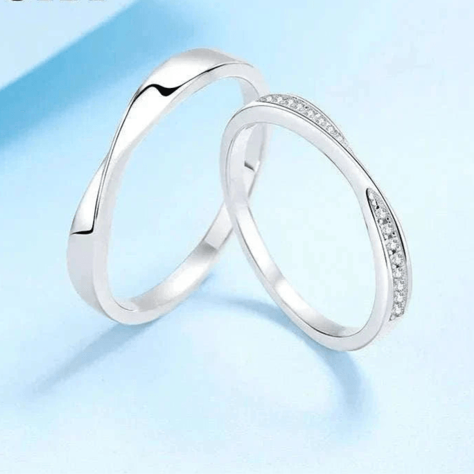 Elegant Platinum Moissanite Couples Ring Set featuring minimalist design and sparkling moissanite stones.