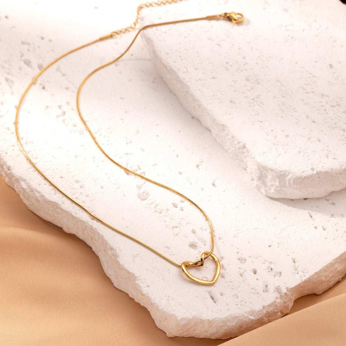 This Twist Hollow Heart Pendant Necklace features a unique design that will add a touch of elegance to any outfit. Made with high-quality materials, it is durable an