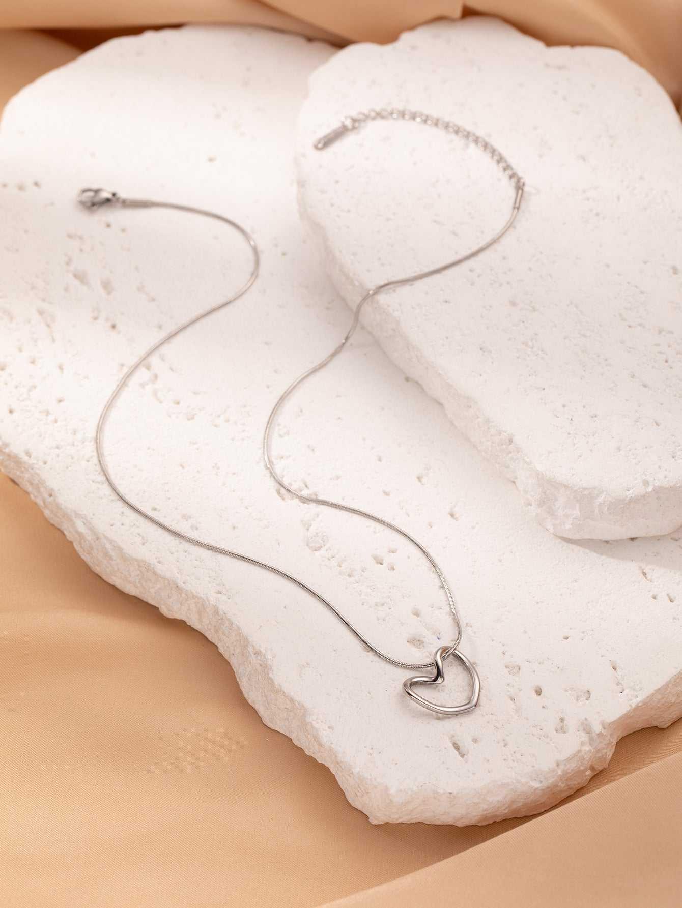 This Twist Hollow Heart Pendant Necklace features a unique design that will add a touch of elegance to any outfit. Made with high-quality materials, it is durable an