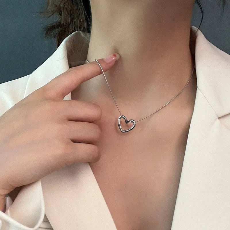 This Twist Hollow Heart Pendant Necklace features a unique design that will add a touch of elegance to any outfit. Made with high-quality materials, it is durable an
