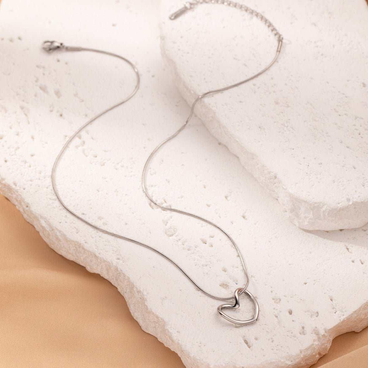 This Twist Hollow Heart Pendant Necklace features a unique design that will add a touch of elegance to any outfit. Made with high-quality materials, it is durable an