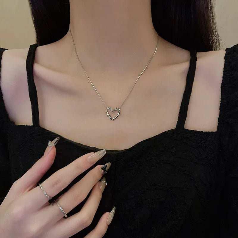 This Twist Hollow Heart Pendant Necklace features a unique design that will add a touch of elegance to any outfit. Made with high-quality materials, it is durable an