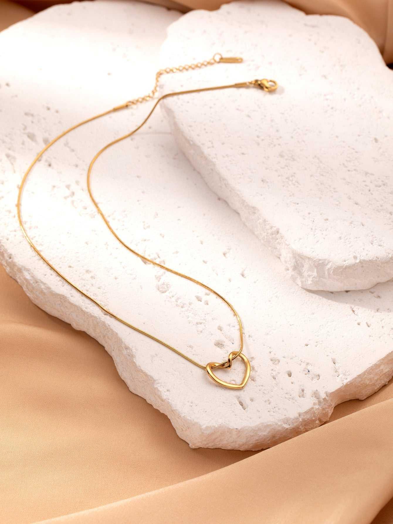 This Twist Hollow Heart Pendant Necklace features a unique design that will add a touch of elegance to any outfit. Made with high-quality materials, it is durable an