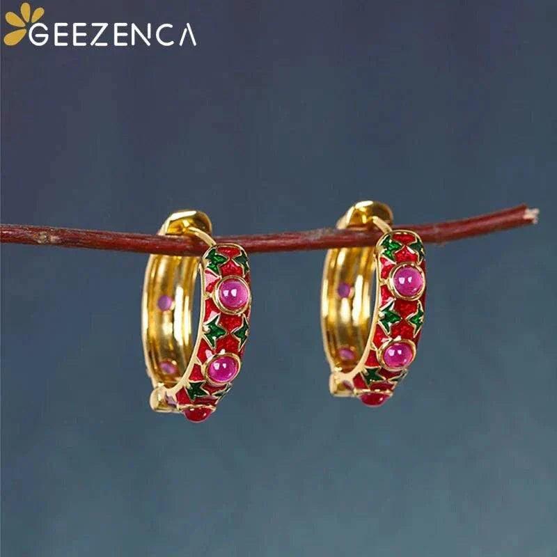Gold plated red corundum hoop earrings with cloisonné and enamel detailing.