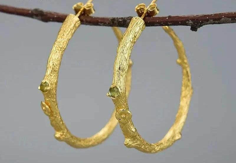 Handmade vintage peridot 925 silver hoop earrings with unique gemstone detail.