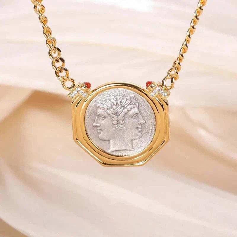 Janus vintage two-faces coin necklace with dual-faced pendant on a gold chain.