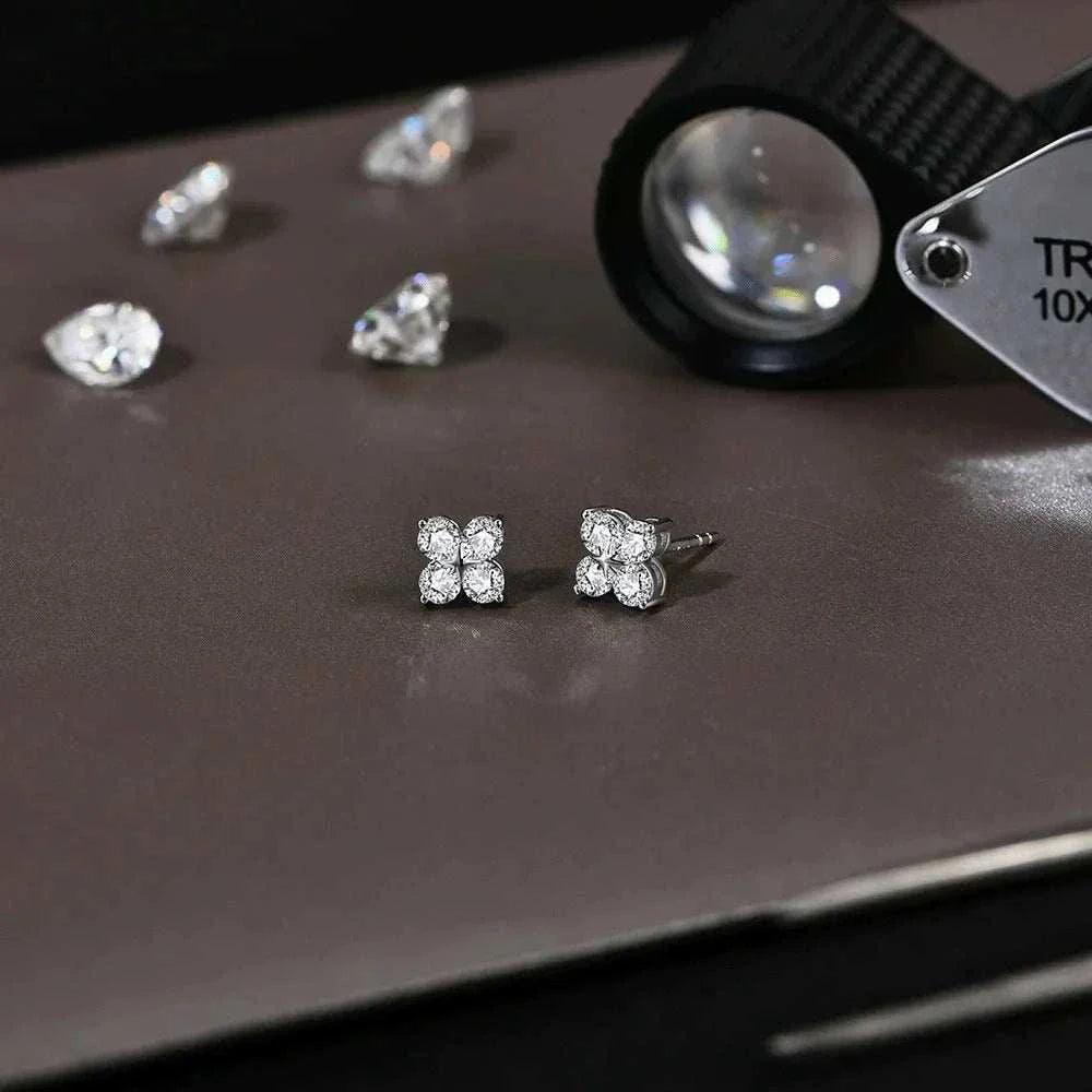 Luxury moissanite clover earrings in white gold, reflecting elegance and sophistication.