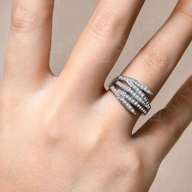 Luxury moissanite engagement ring on hand, S925 sterling silver band with sparkling moissanite stones.