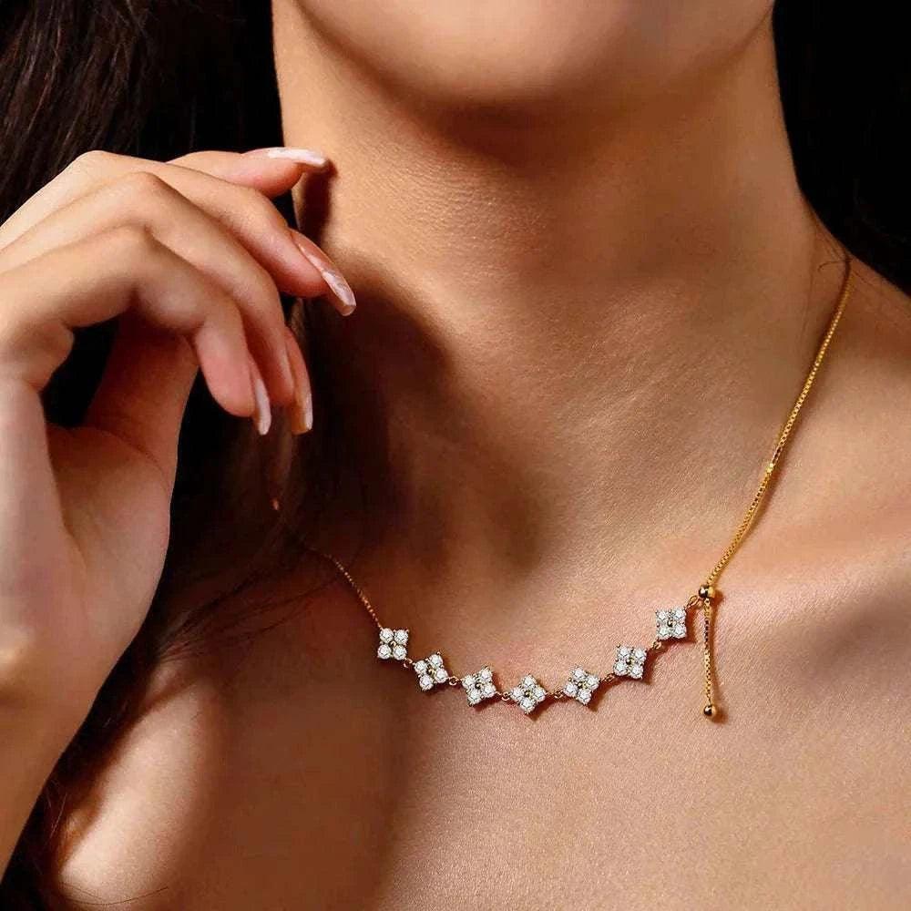 Luxury moissanite necklace in silver and gold with sparkling gemstones.