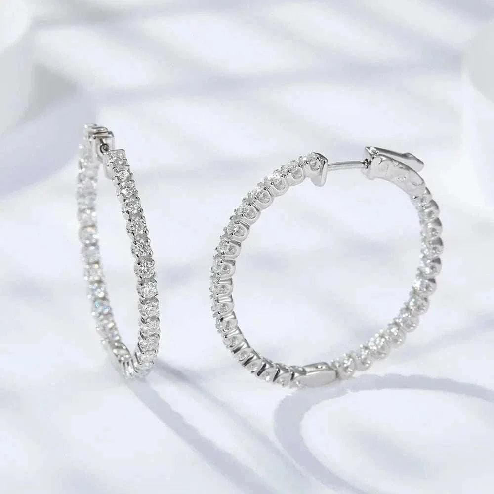 Luxury VVS Moissanite sterling silver hoop earrings with 1.56 CT stones and remarkable clarity.