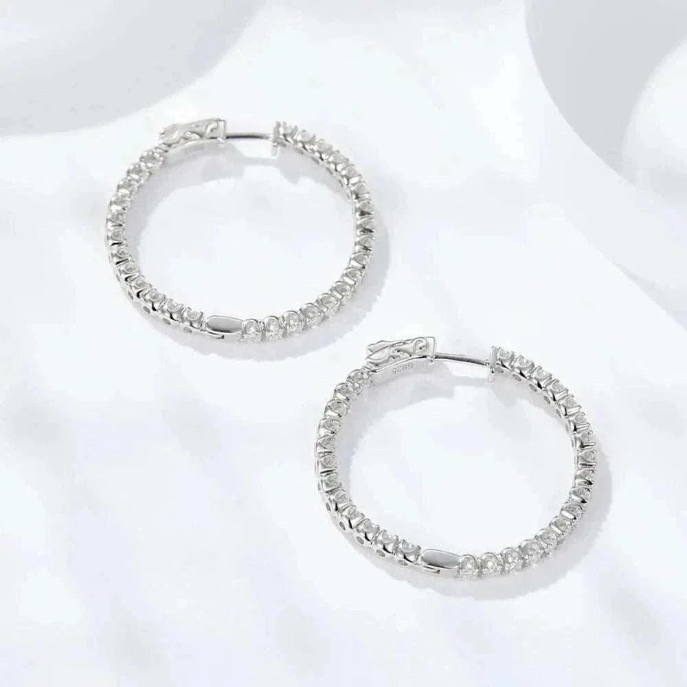 Luxury VVS Moissanite sterling silver hoop earrings with sparkling stones.