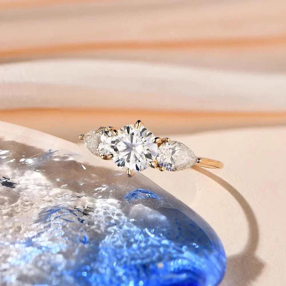 Moissanite halo engagement ring in yellow gold, featuring a central 1CT VVS1 moissanite with dazzling accents.