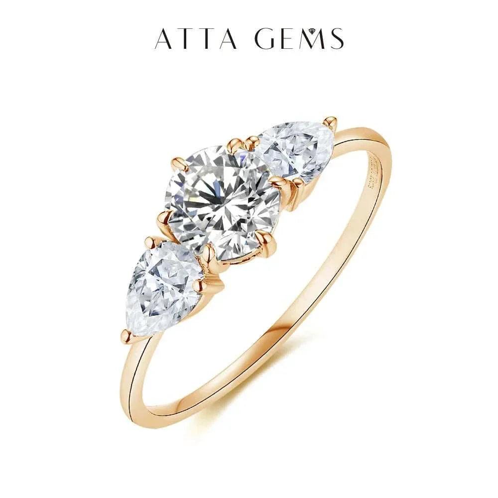 Moissanite Halo Engagement Ring in Yellow Gold featuring three brilliant stones.