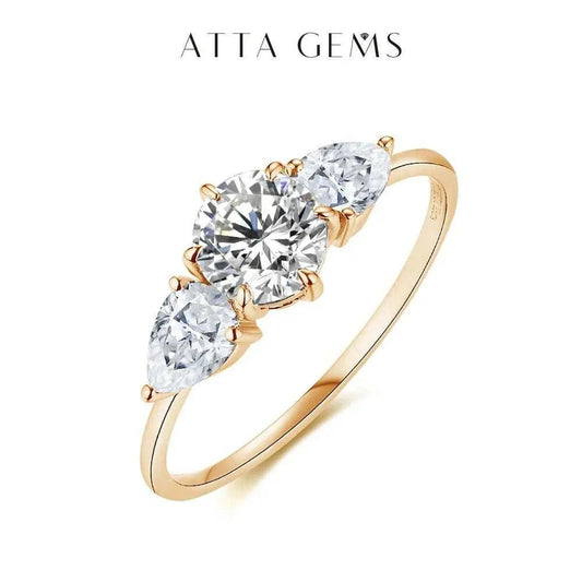 Moissanite Halo Engagement Ring in Yellow Gold featuring three brilliant stones.