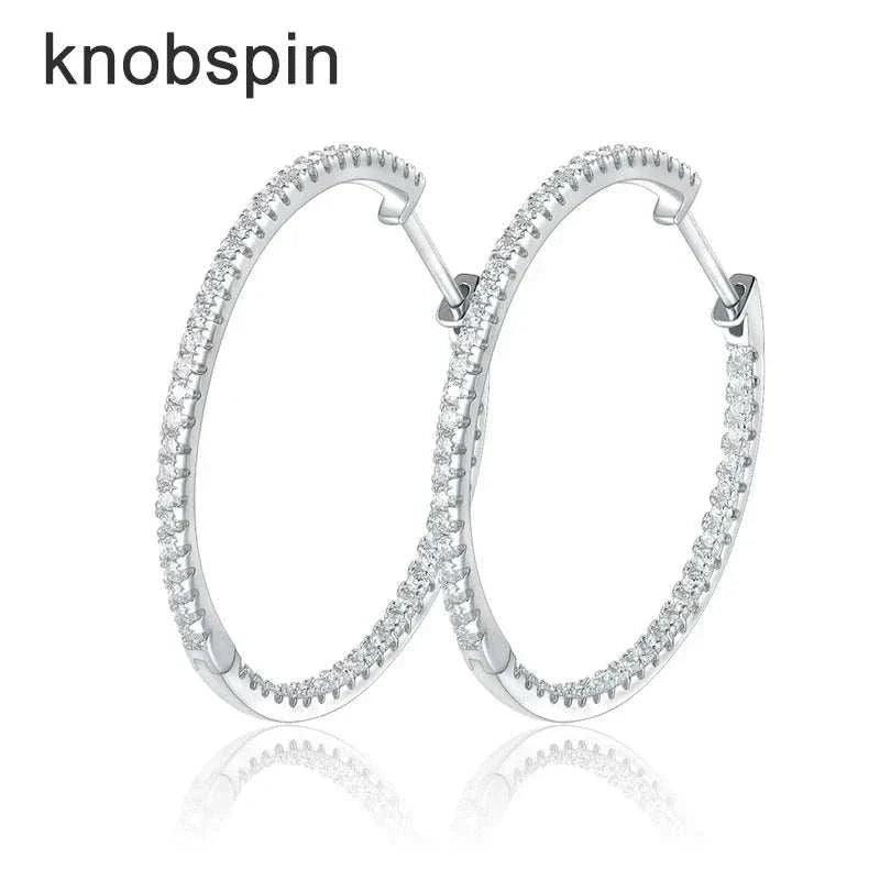 Moissanite loop earrings in 925 sterling silver with sparkling stones.