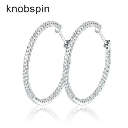 Moissanite loop earrings in 925 sterling silver with sparkling stones.