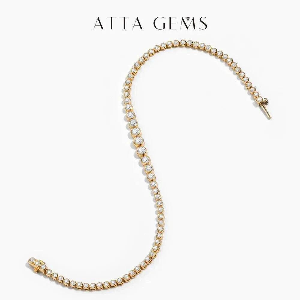Moissanite tennis bracelet in 18k gold showcasing gradient design and sparkling stones.