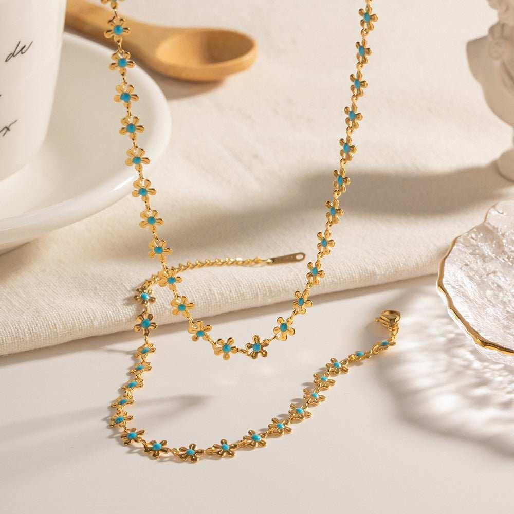 Add a touch of elegance to your outfit with our Glaze Flowers Necklace and Bracelet set. Made with delicate, handcrafted flowers, this set is perfect for any formal 