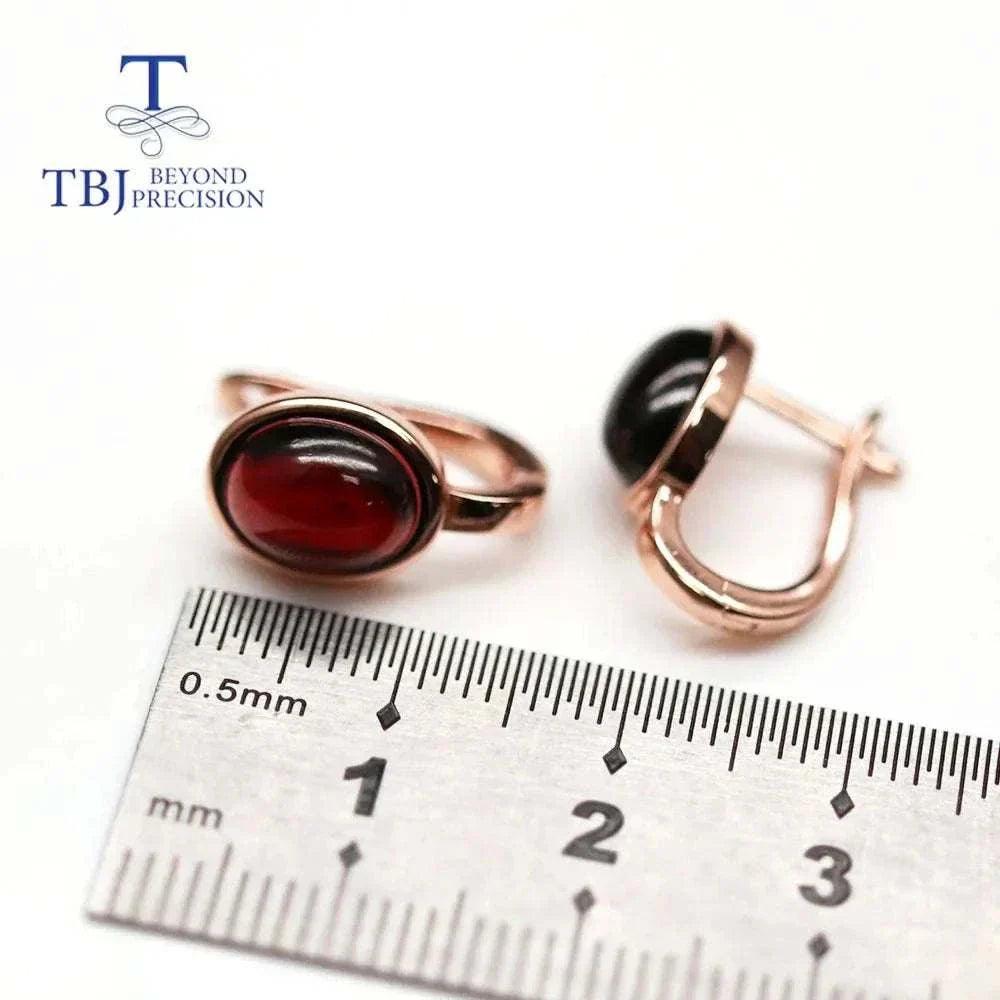 Natural Mozambique garnet silver earrings with 4.6ct oval-cut stones and rose gold-plated 925 sterling silver setting.