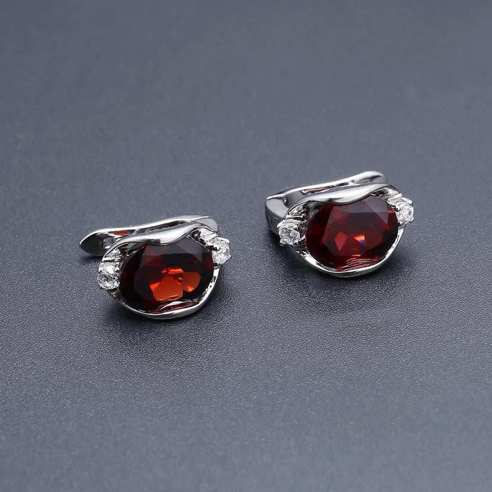 S925 silver natural garnet stud earrings on display with vibrant garnet hue.