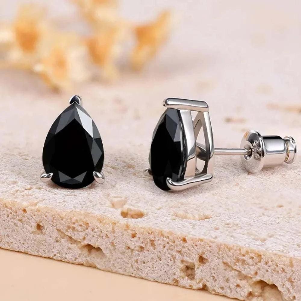Timeless moissanite sterling silver stud earrings with pear-cut black gem design.